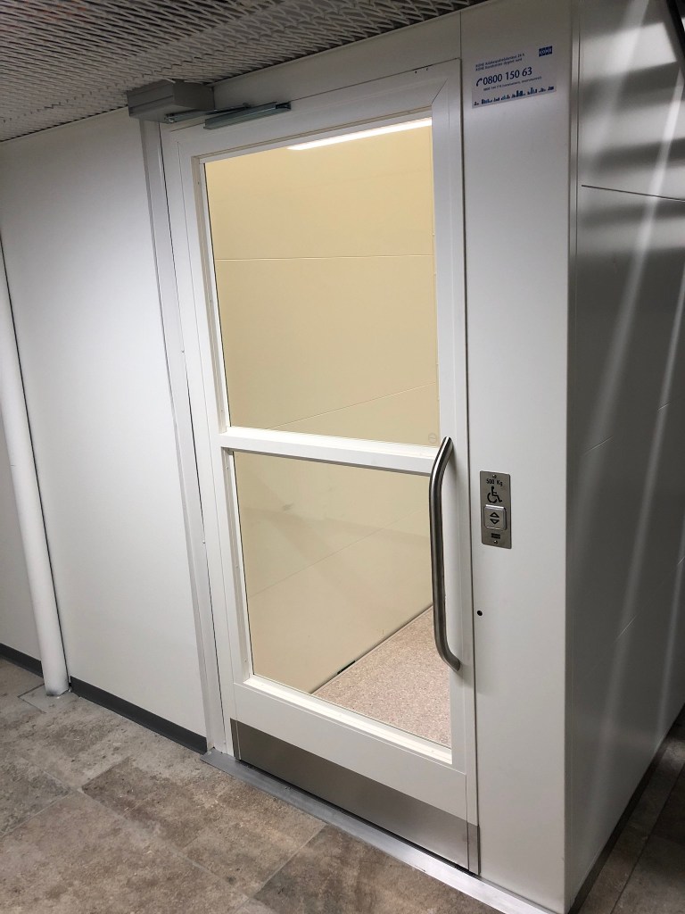 Door to small wheelchair lift